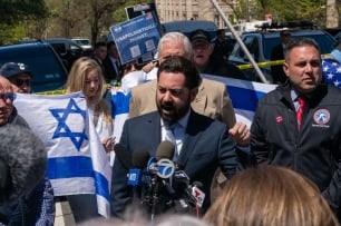 Representative Mike Lawler stands before a microphone at a press conference outside Columbia University.